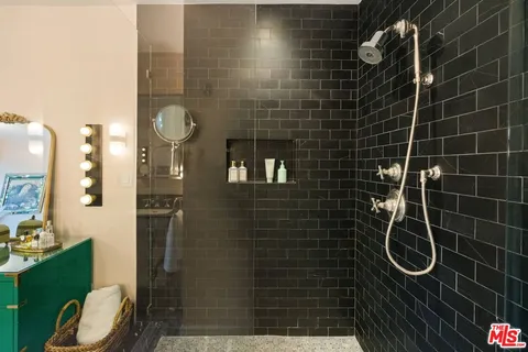 a front view of a house with swimming pool and trees