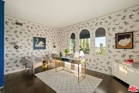 an aerial view of residential houses with outdoor space and street view