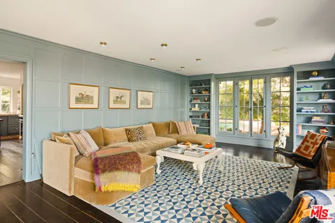 a kitchen with sink refrigerator and cabinets