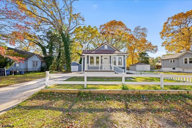 a kitchen with stainless steel appliances white cabinets and sink