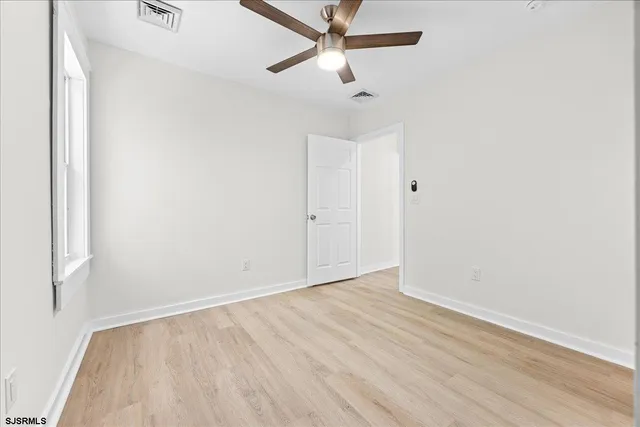a view of a room with wooden walls