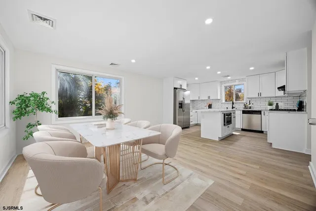 a view of a hallway with stairs
