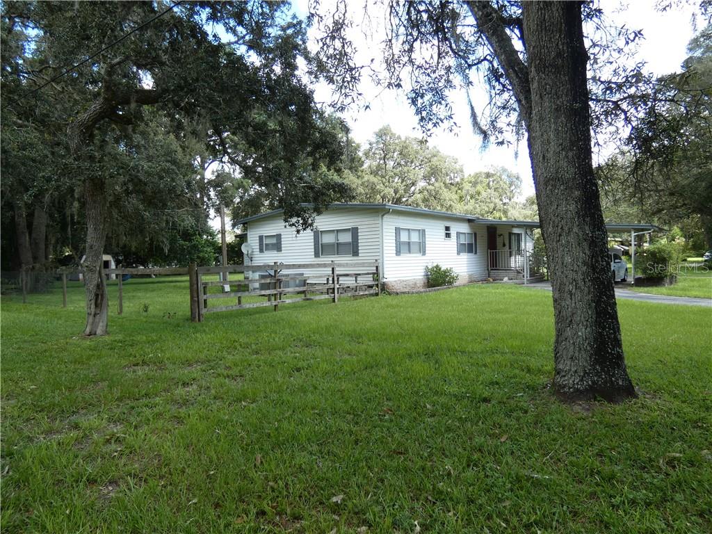 15383 County Line Road Brooksville, FL 34604 - Photo 1 of 1 a house view with swimming pool and garden