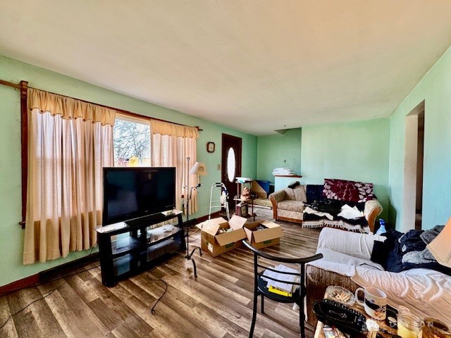 4733 Curtis Drive Springfield, OH 45503 - Photo 10 of 50 This living room features ample natural light and durable wood-look flooring.