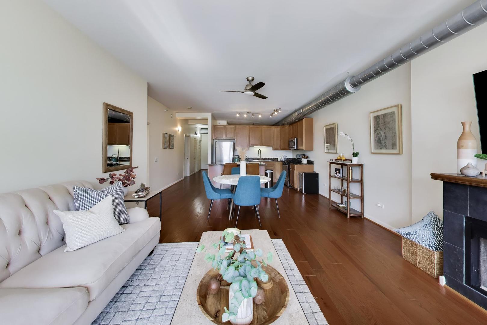 1200 West Monroe Street, Unit 502 Chicago, IL 60607 - Photo 4 of 34 a living room with furniture and a wooden floor