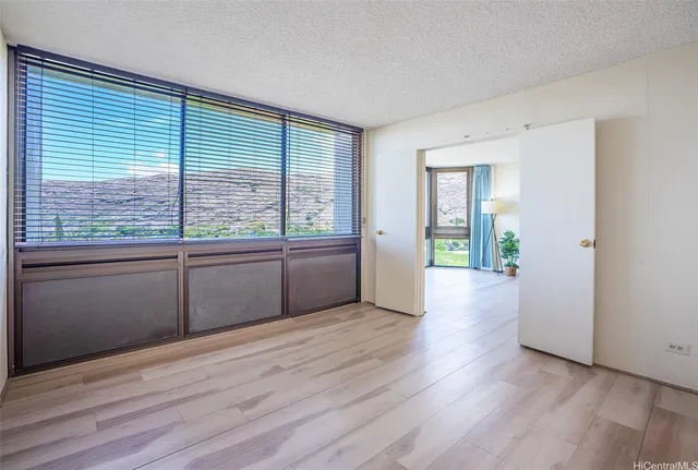 a view of a room with window and wooden floor