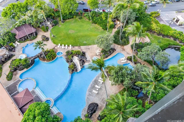 an aerial view of a house with garden space and street view