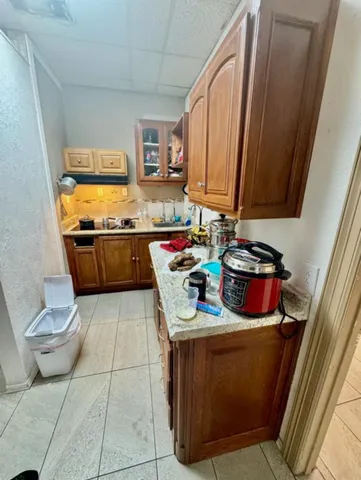 a kitchen with a stove and a refrigerator