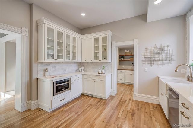 a kitchen with a stove oven and sink