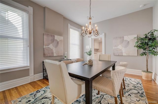 a view of a dining room with furniture and window