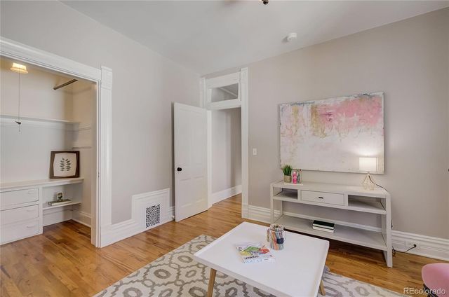 a bedroom with a bed and a desk