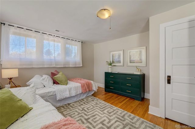 a bedroom with a bed and a dresser