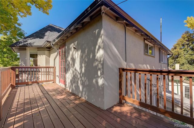 a balcony view with wooden floor and fence