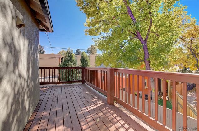 a view of balcony with wooden floor