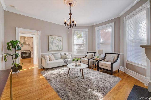 a living room with furniture and a rug