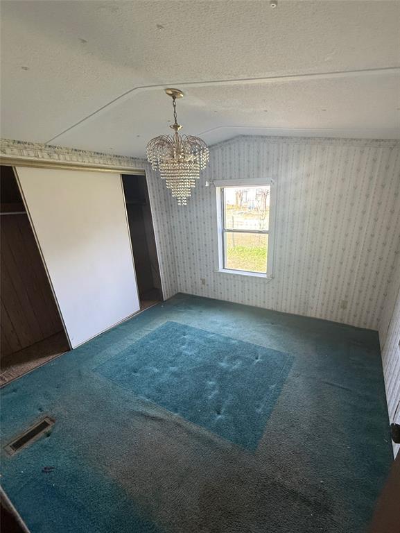 104 Lilly Street Kosse, TX 76653 - Photo 12 of 15 a view of empty room with windows