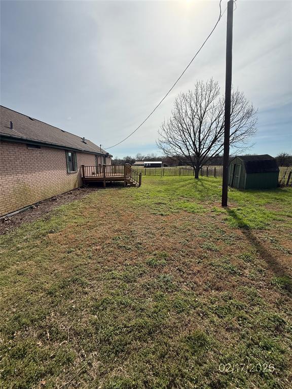 104 Lilly Street Kosse, TX 76653 - Photo 4 of 15 a view of a yard with an outdoor space