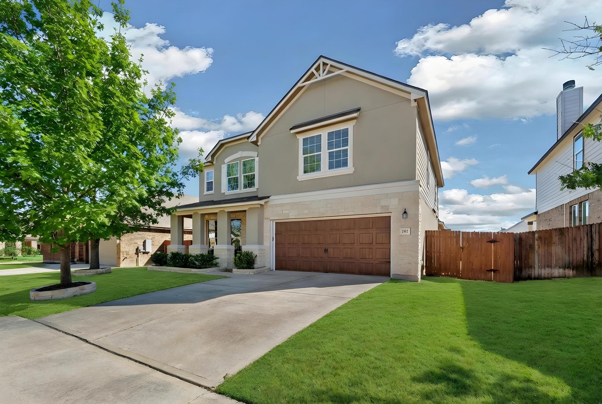 Virtual -View of front of house featuring an attached garage, driveway, a gate, stucco siding, and a porch