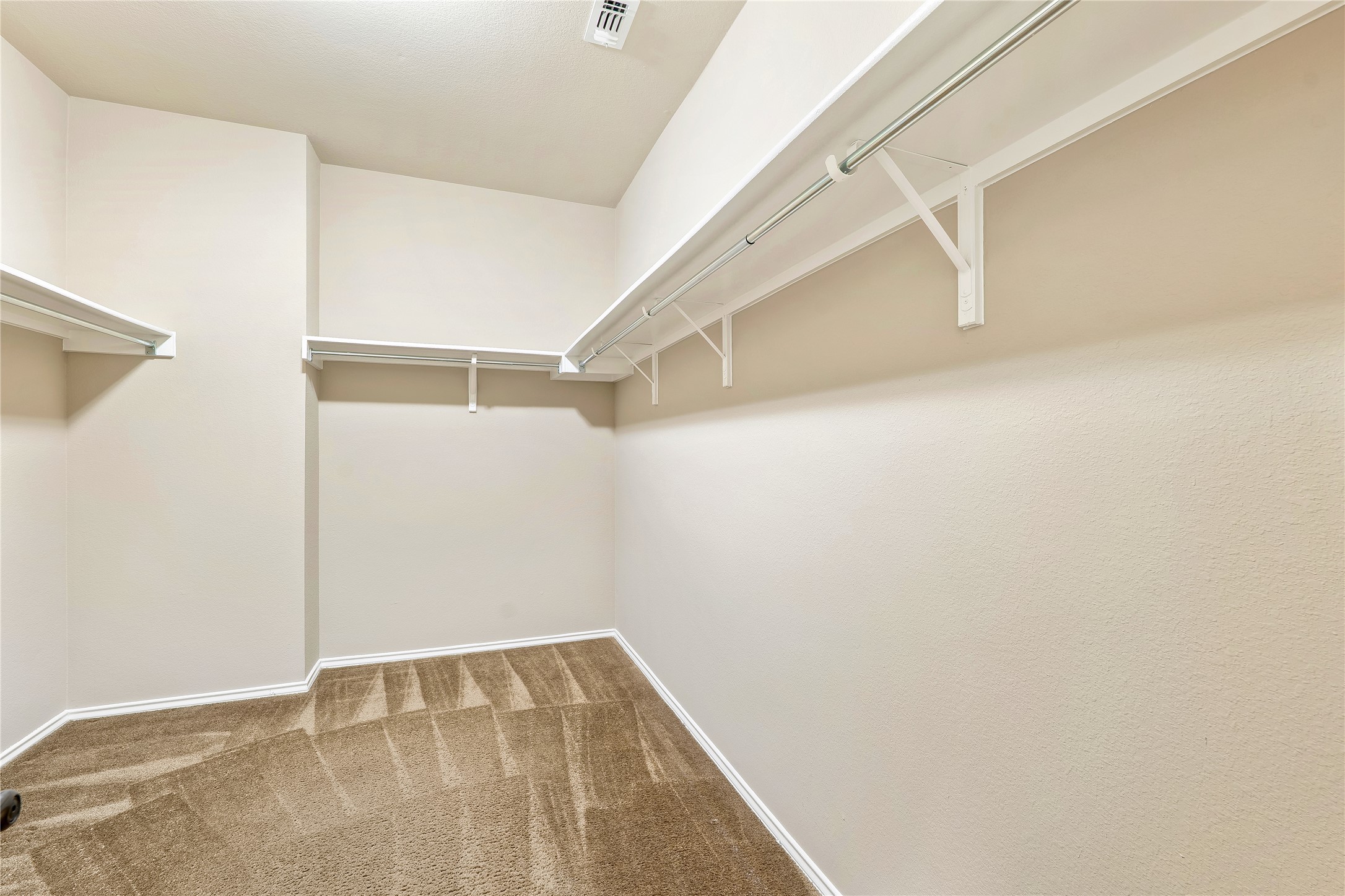 207 Telluride Drive Georgetown, TX 78626 - Photo 18 of 40 Enjoy the large walking closet featuring light carpet.