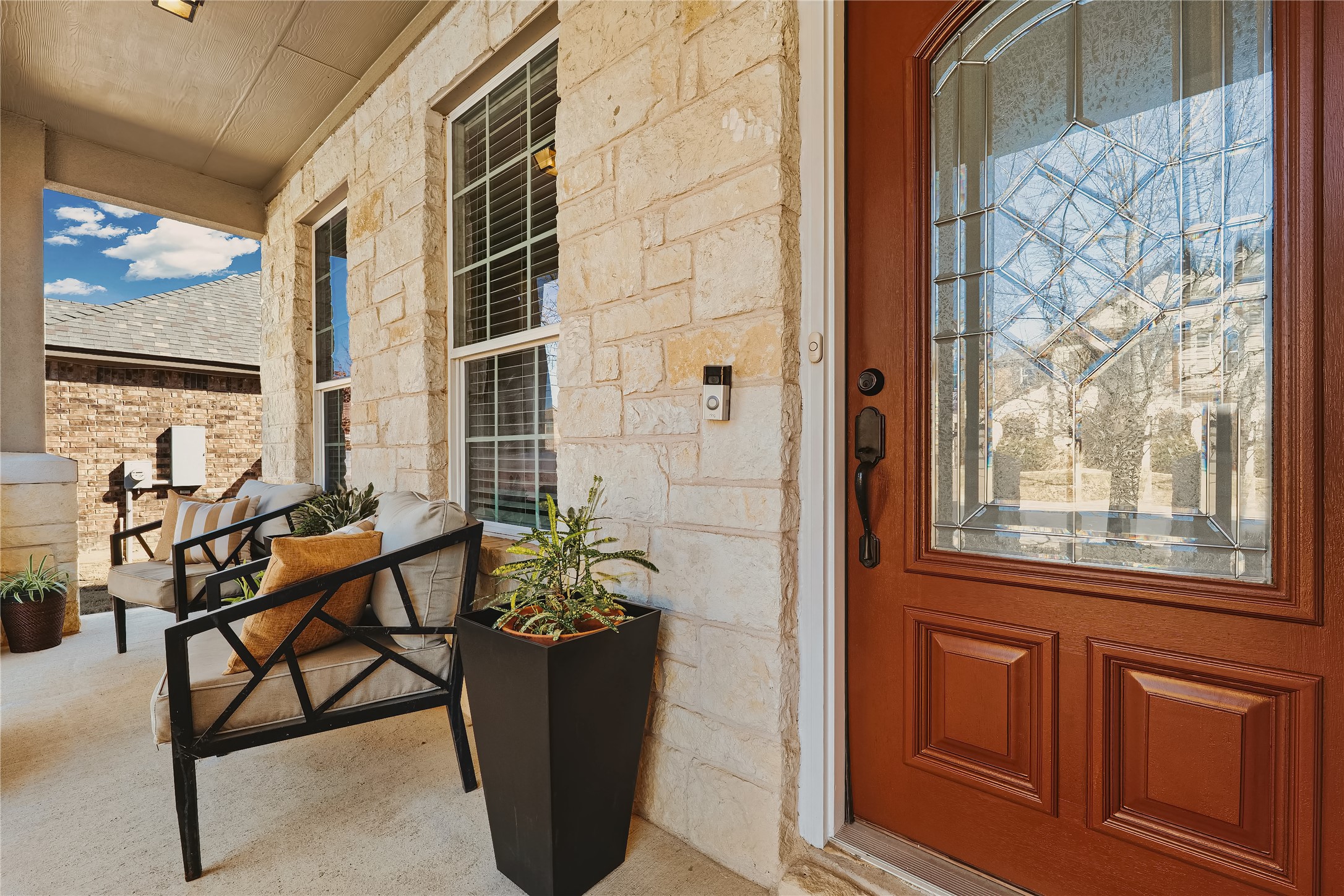 207 Telluride Drive Georgetown, TX 78626 - Photo 3 of 40 Property entrance featuring stone siding and covered front porch