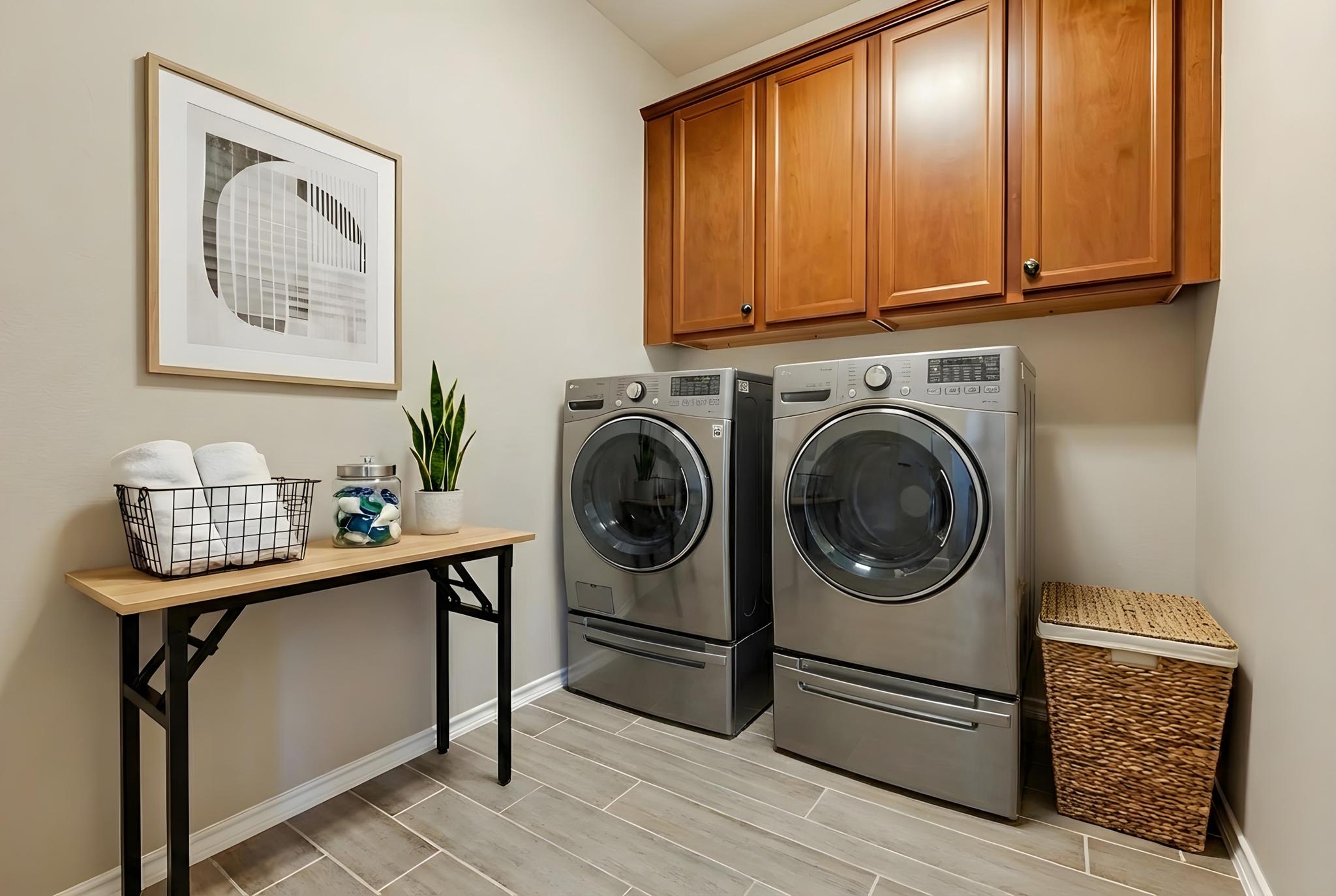 207 Telluride Drive Georgetown, TX 78626 - Photo 34 of 40 Virtual Stage Laundry room featuring tile wood finish floors, independent washer and dryer, and cabinet space