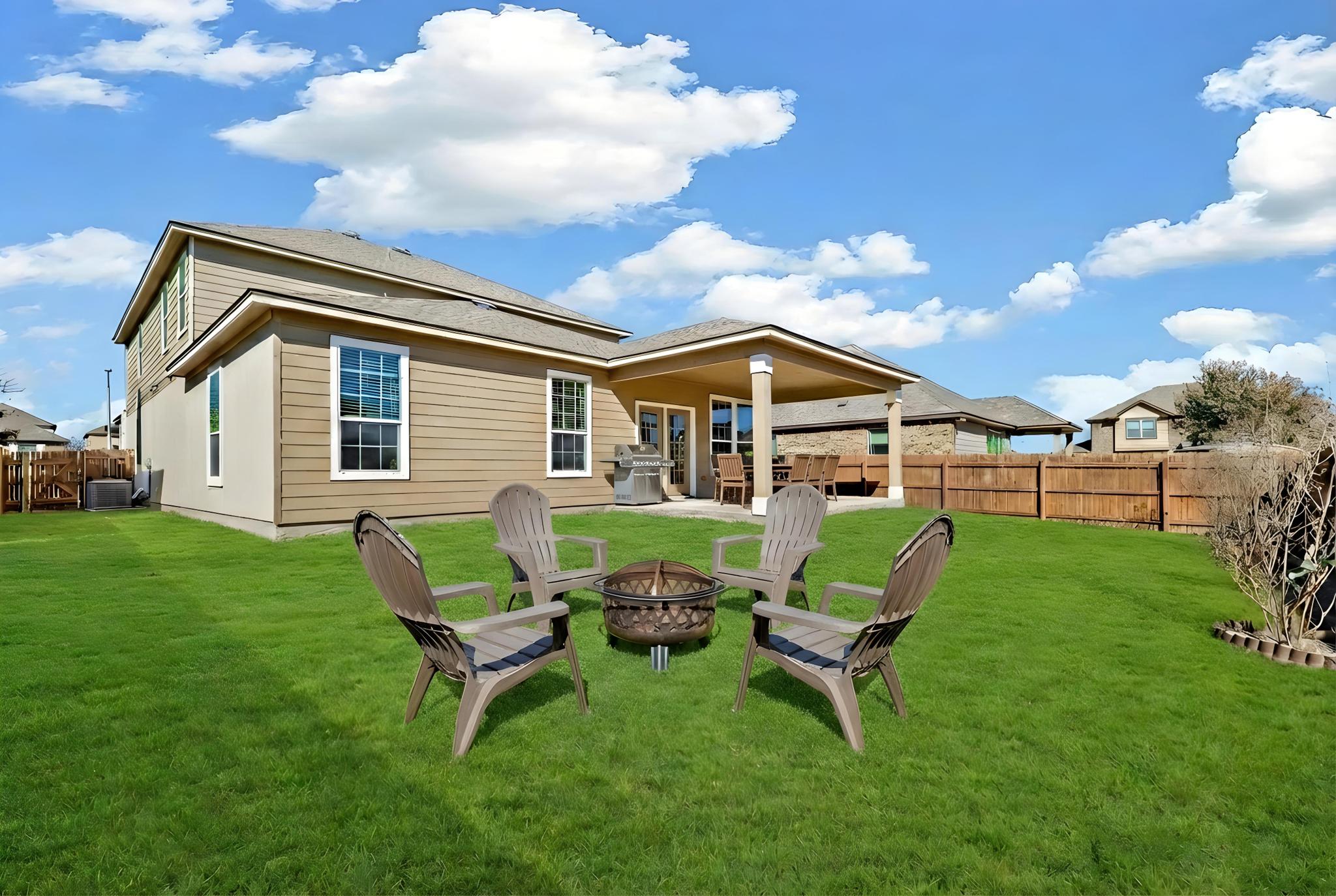 207 Telluride Drive Georgetown, TX 78626 - Photo 36 of 40 Virtual Stage Back of house with a patio area and a fenced backyard