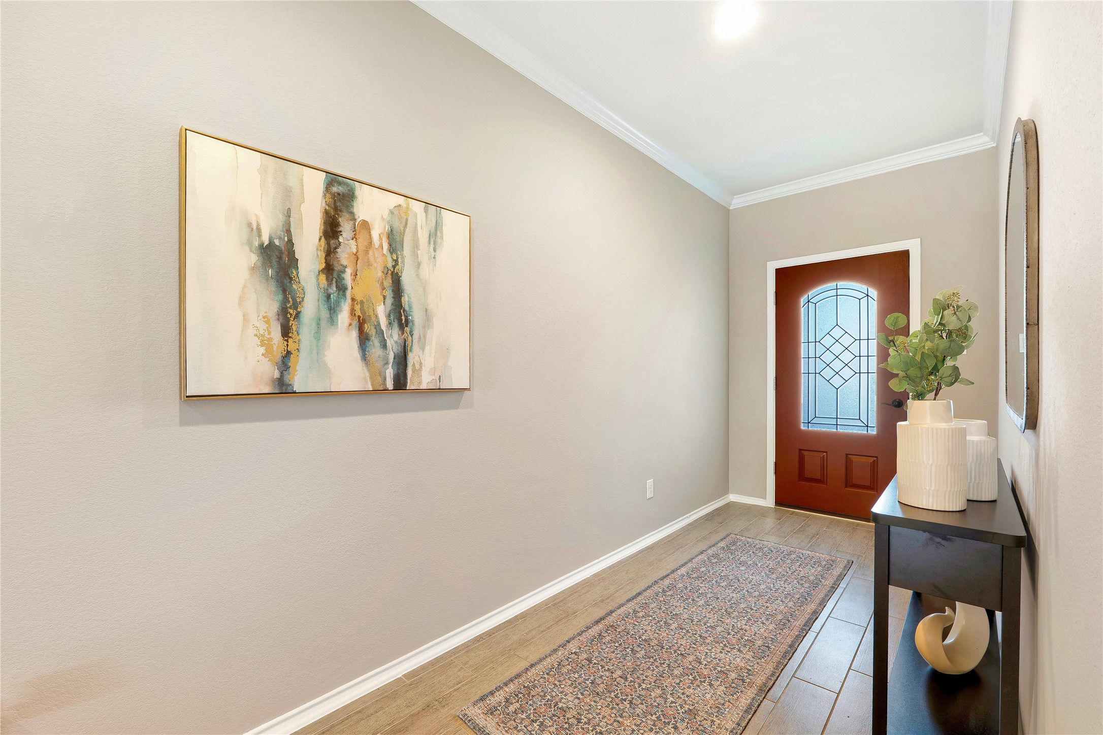 207 Telluride Drive Georgetown, TX 78626 - Photo 4 of 40 Entrance foyer with crown molding and light tile wood-style flooring
