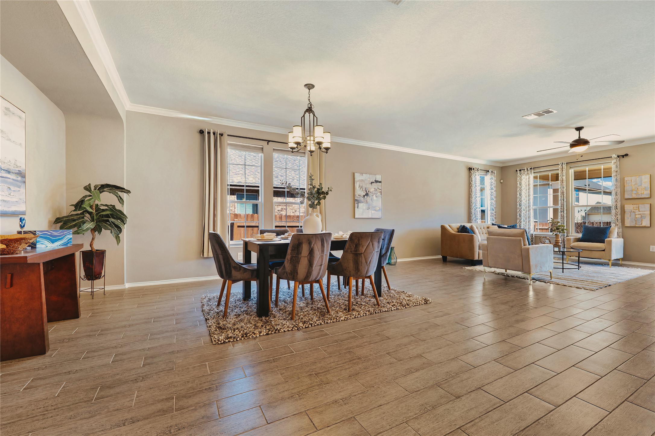 207 Telluride Drive Georgetown, TX 78626 - Photo 6 of 40 Spacious dining room , crown molding, tile wood finish floors. Lots of windows providing both area with tons of natural light.