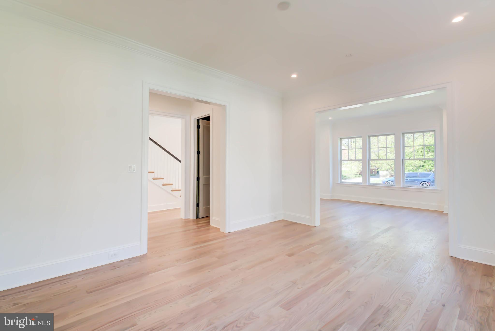3118 Patterson Street Northwest Washington, DC 20015 - Photo 11 of 79 an empty room with wooden floor and windows