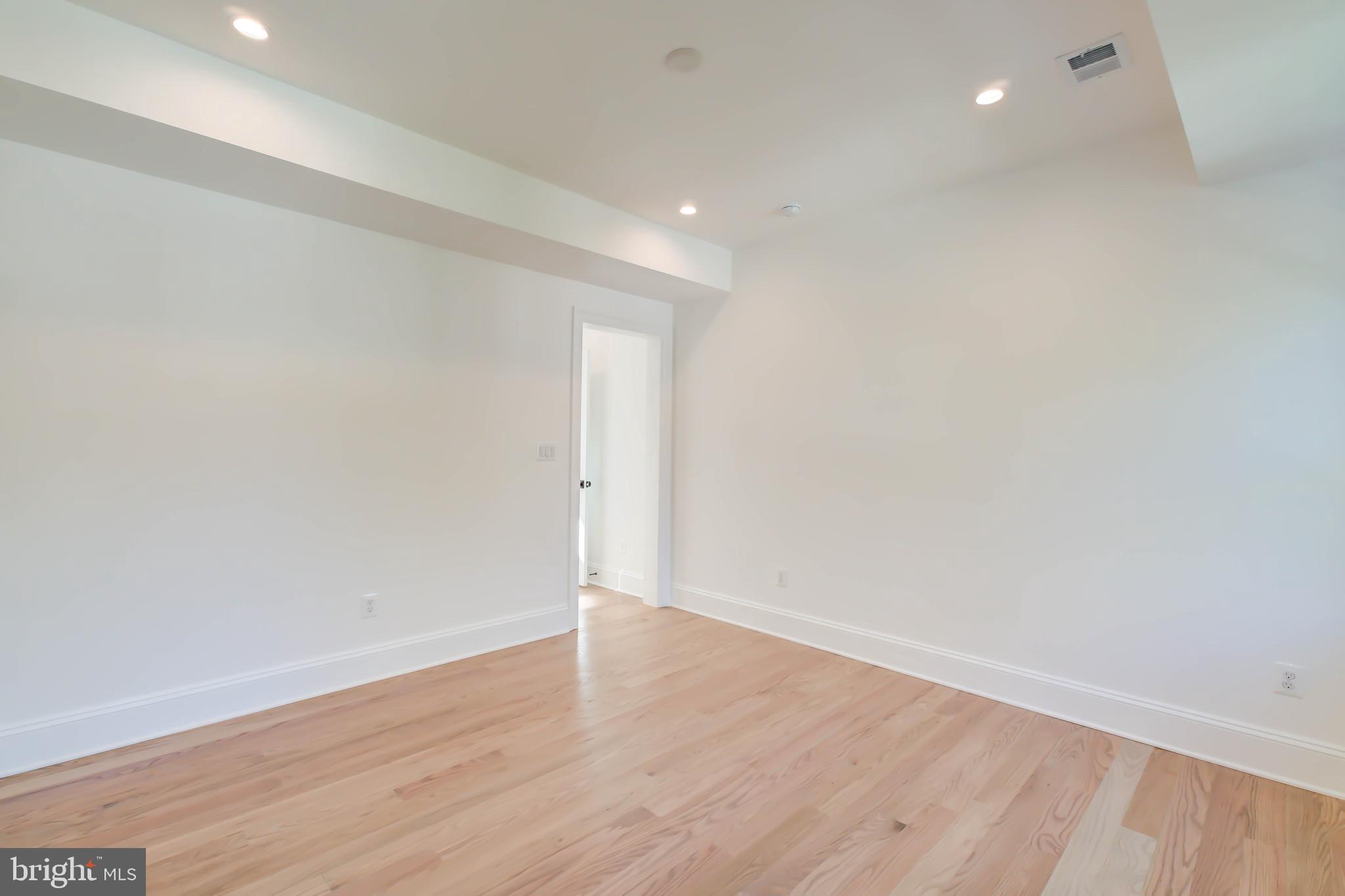 3118 Patterson Street Northwest Washington, DC 20015 - Photo 45 of 79 a view of an empty room with wooden floor
