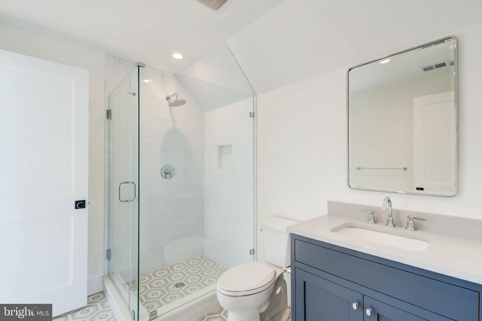 3118 Patterson Street Northwest Washington, DC 20015 - Photo 59 of 79 a bathroom with a granite countertop sink a toilet and shower