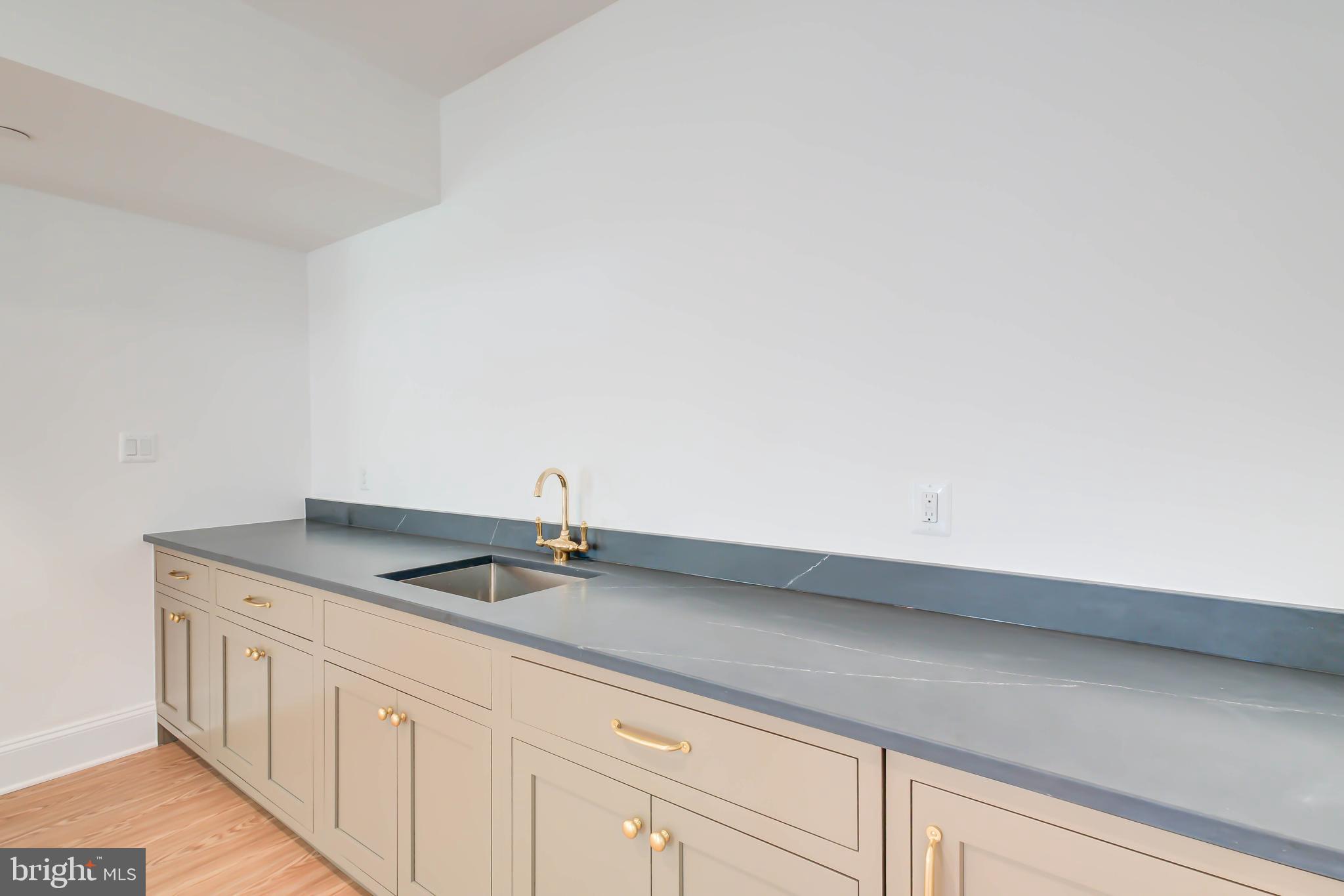 3118 Patterson Street Northwest Washington, DC 20015 - Photo 63 of 79 a kitchen with a sink and cabinets