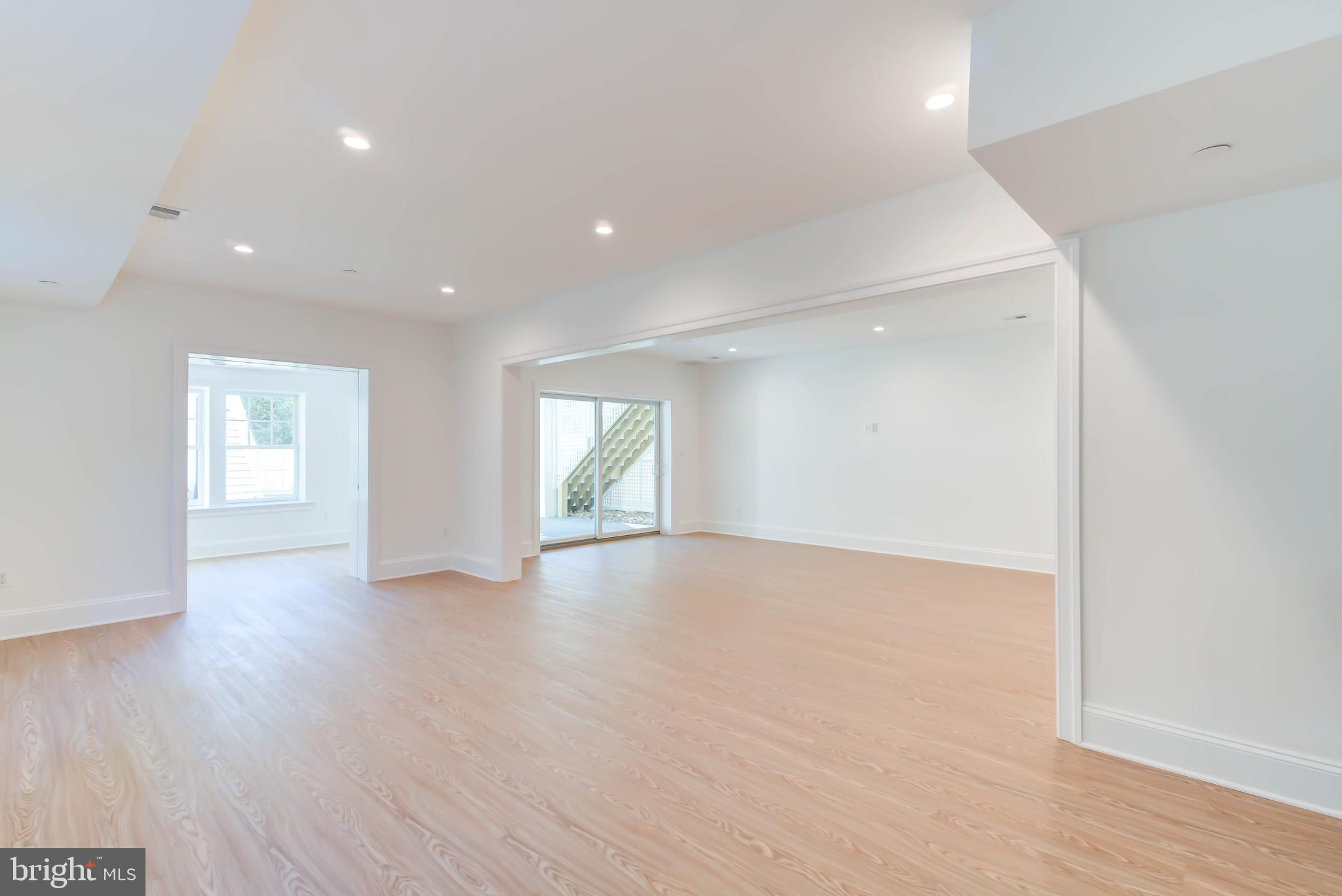 3118 Patterson Street Northwest Washington, DC 20015 - Photo 64 of 79 an empty room with wooden floor and windows