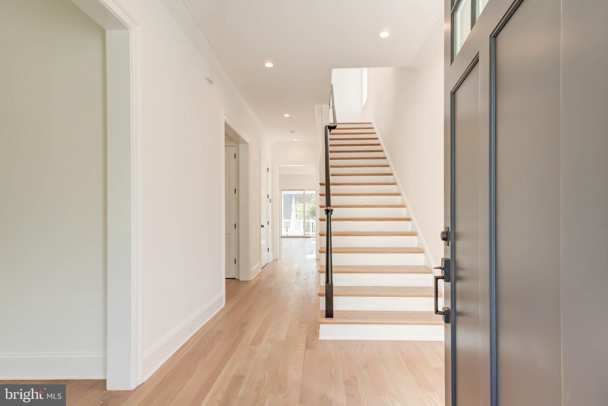 3118 Patterson Street Northwest Washington, DC 20015 - Photo 7 of 79 a view of a hallway with wooden floor and stairs
