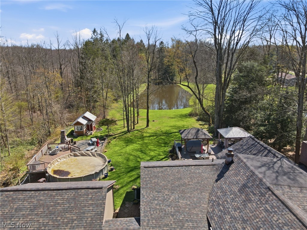 8965 Cedar Road Chesterland, OH 44026 - Photo 43 of 50 View of Above Ground Pool, Patio, She Shed, Pond and Second 10x20' Shed