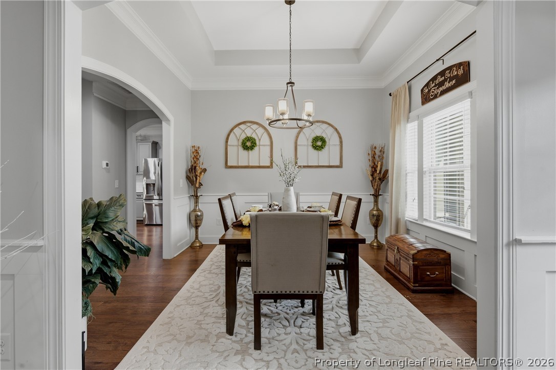 148 Heatherspring Way Spring Lake, NC 28390 - Photo 8 of 50 a view of a dining room with furniture window and wooden floor