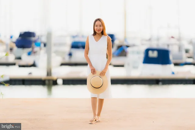 a backyard of a house with lots of green space and plants