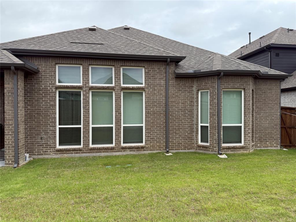 6246 Shasta Creek Road Celina, TX 75009 - Photo 4 of 24 a view of a brick house with a large windows