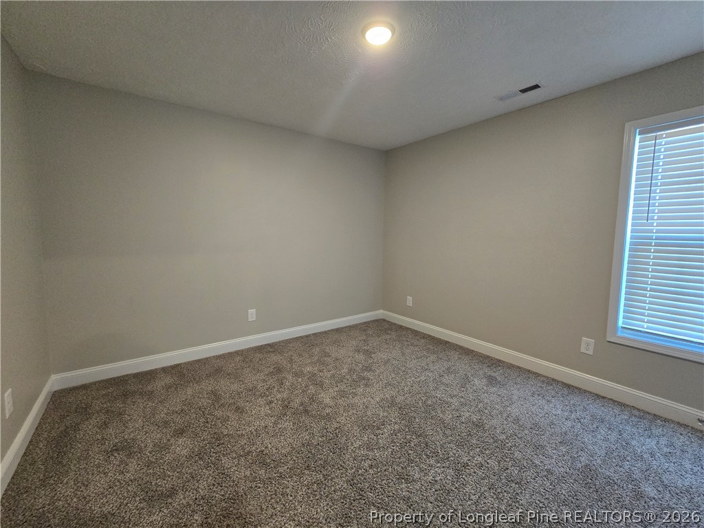 422 Mitchell Farm Road Goldsboro, NC 27530 - Photo 11 of 28 an empty room with a window