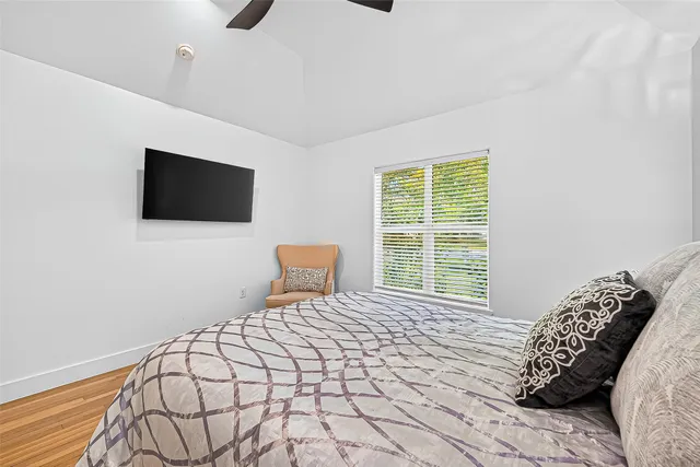 a bathroom with a sink a mirror a vanity and a window