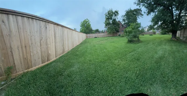 a view of backyard with green space