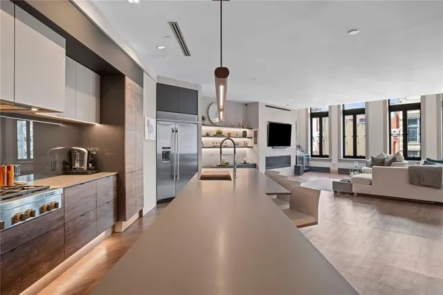 a living room with fireplace furniture and a flat screen tv