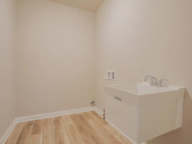 a bathroom with a sink toilet and vanity
