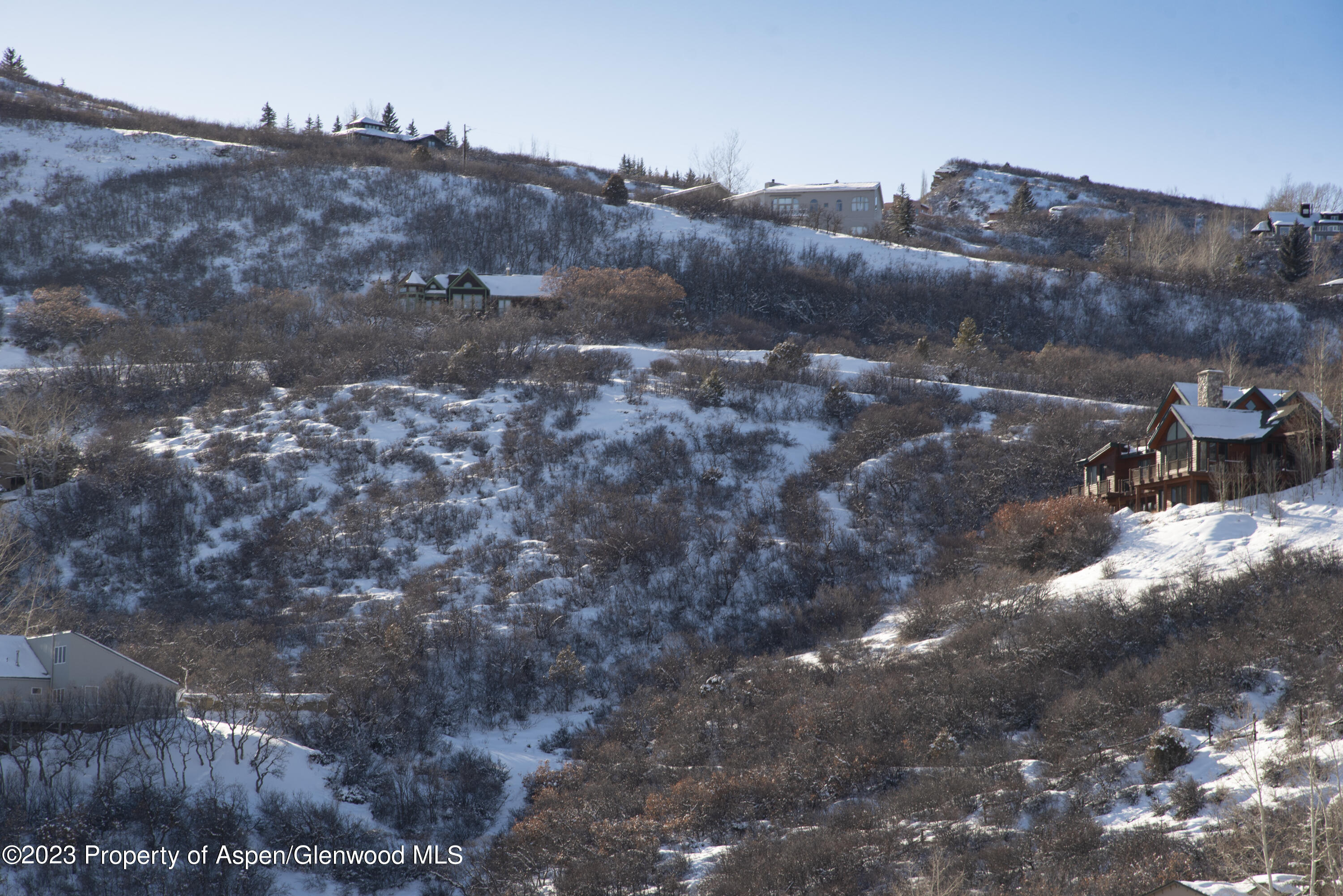 54 Red Tail Lane Aspen, CO 81611 - Photo 11 of 15 a view of a dry yard with mountains in the background
