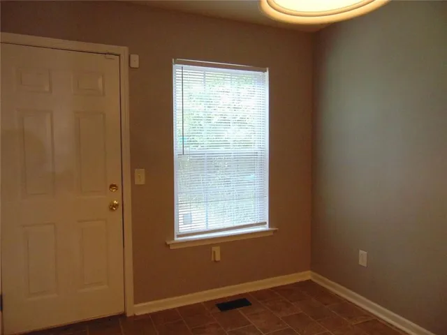 a view of a room that has a window in it