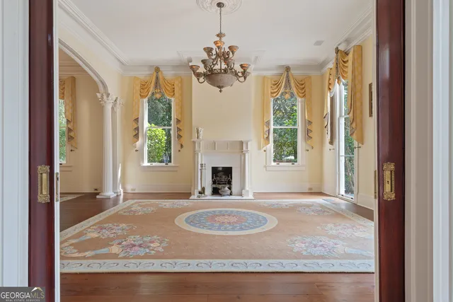 a kitchen with a checkered floor and white cabinets