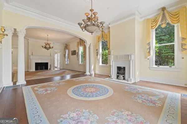 a kitchen with stainless steel appliances granite countertop a sink a stove a refrigerator and cabinets