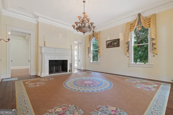 a living room with a fireplace and a window