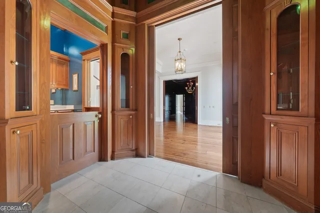 a bathroom with a granite countertop sink a mirror and a bathtub