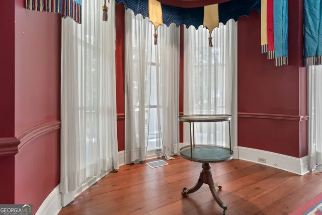 a view of a house with a yard and a fountain
